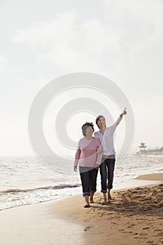 Grandmother and Granddaughter Taking a Walk by the Beach