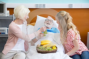 Grandmother and granddaughter visiting patient