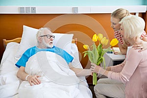 Grandmother and granddaughter visiting patient