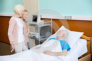 Grandmother and granddaughter visiting patient