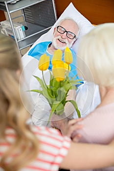 Grandmother and granddaughter visiting patient