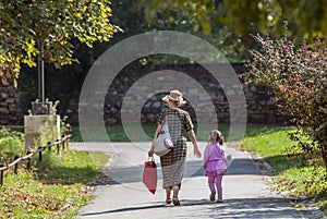 Grandmother and granddaughter walking