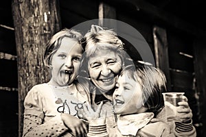 Grandmother with Granddaughters Smiling