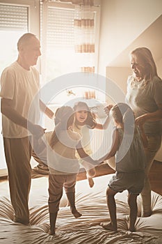 Grandmother and grandfather together with their granddaughters