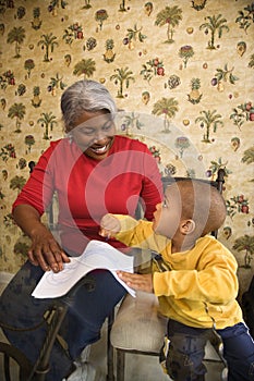 Grandmother with grandson coloring.