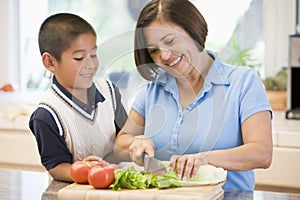 Grandmother And Grandson Preparing meal