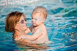 Grandmother and grandson swim