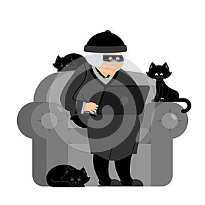 Grandmother hacker sits on an armchair with laptop and cat. gran