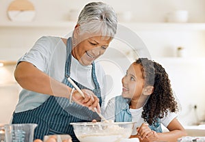 Grandmother, happy or child baking in kitchen as a happy family with young girl learning cookies recipe. Mixing cake