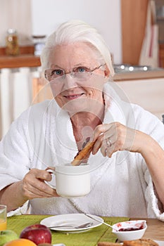 Grandmother having breakfast