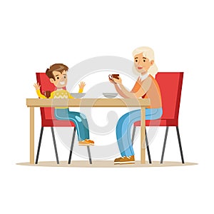 Grandmother Having Breakfast With Boy, Part Of Grandparents Having Fun With Grandchildren Series