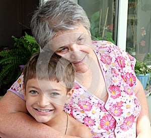 Grandmother with her grandson together looking happy