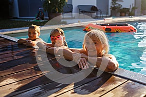 Grandmother and kids enjoy poolside moment, active way of life, love between different generations