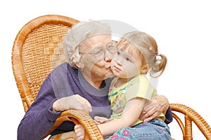 Grandmother kisses the granddaughter