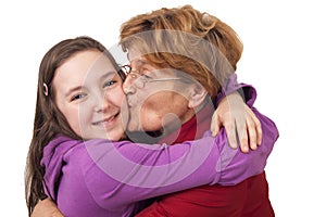 Grandmother kissing granddaughter