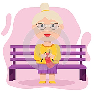 Grandmother knits sitting on a bench. Elderly people