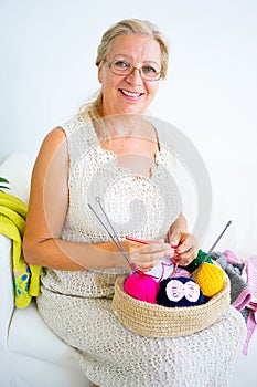 Grandmother knitting at home