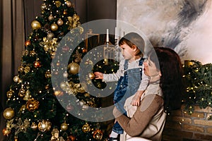 Grandmother and little granddaughter spend time together at Christmas time.