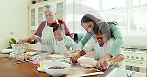 Grandmother, mom and girls in a kitchen, bake and learning with ingredients, recipe and home. Mama, granny and female