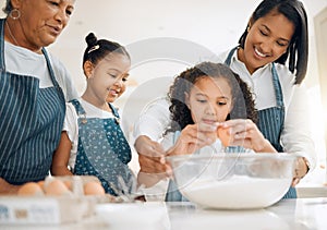 Grandmother, mom or kids baking in kitchen as a happy family with young girl learning cookies recipe. Mixing cake