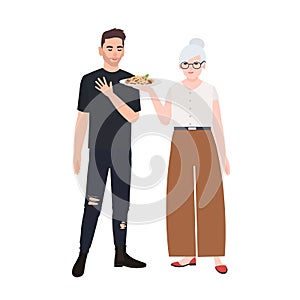 Grandmother offering plate with pasta to her grandson. Cute smiling elderly woman giving tasty meal to teenage boy