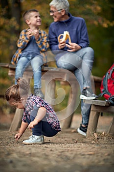 Grandmother on a picnic with her grandchildren