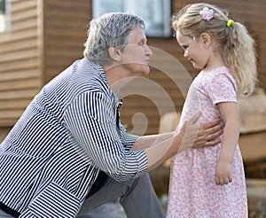 Grandmother plays with her granddaughter