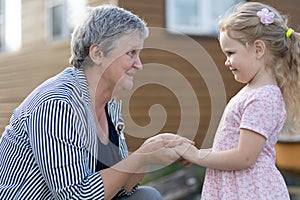 Grandmother plays with her granddaughter