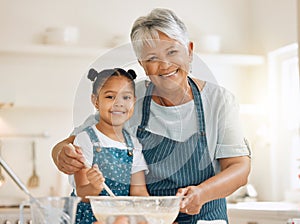 Grandmother, portrait or child baking in kitchen as a happy family with young girl learning cookies recipe. Mixing cake