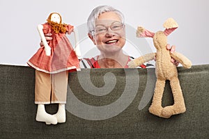 Grandmother presenting a puppet show