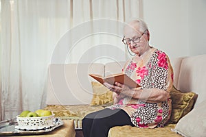 Grandmother reading alone