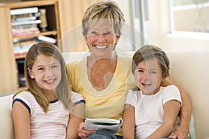 Grandmother reading with grandchildren