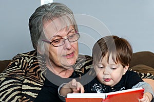 Grandmother reading to grandchild