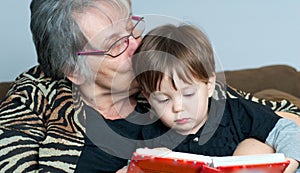 Grandmother reading to grandchild