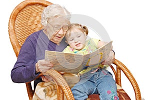 Grandmother reads to the granddaughter