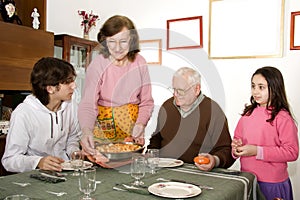 Grandmother serving food