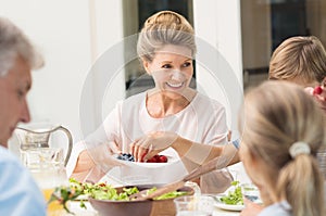 Grandmother serving food