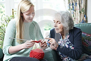 Grandmother Showing Granddaughter How To Knit