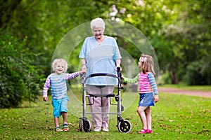 Grandmother with walker playing with two kids