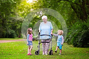 Grandmother with walker playing with two kids