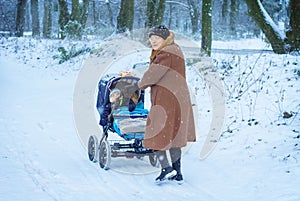 Grandmother walking with baby boy in winter