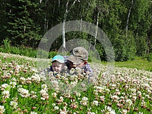 Grandpa and grandson look for clover