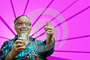 Grandpa shows thumb up on pink background
