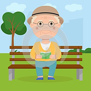 Grandpa sits on a bench in the park and reads a book