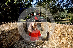 Grandpa taking granddaughter on a hayride