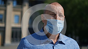 Grandparent breathes fresh air in park wear mask while Covid19 dangerous. People
