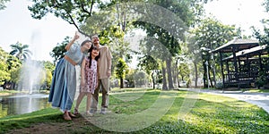 Grandparent enjoy with granddaughter in park surrounded with greenery and serenity. having joyful and cheerful time