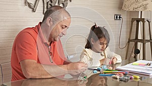 Grandparent and girl playing at home