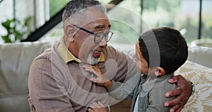 Grandparent, love or boy with grandfather on sofa for hug, bonding or conversation at home. Kids, family and senior man