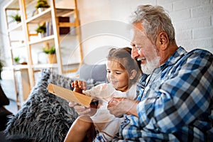 Grandparent playing and having fun with their granddaughter